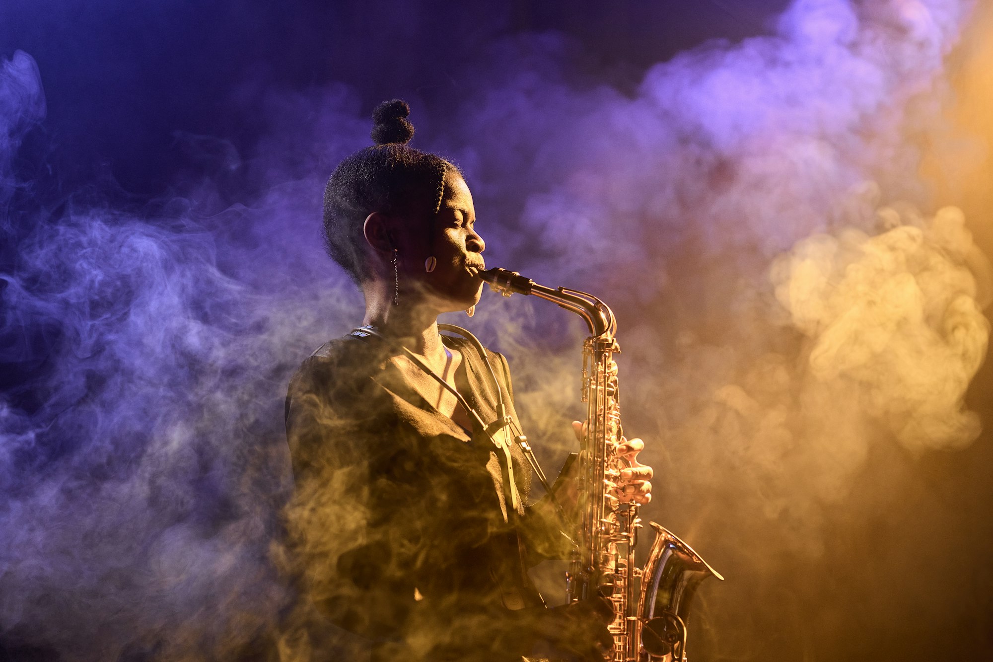 Black Woman Playing Saxophone In Smoke
